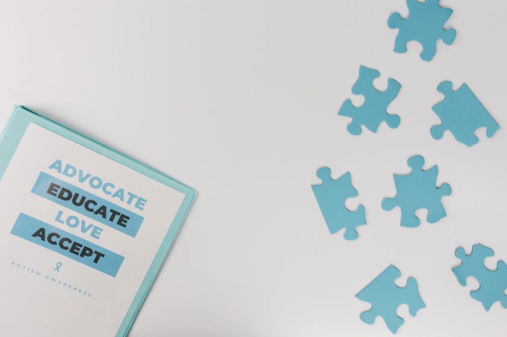 Blue puzzle pieces with advocacy messages for autism awareness.